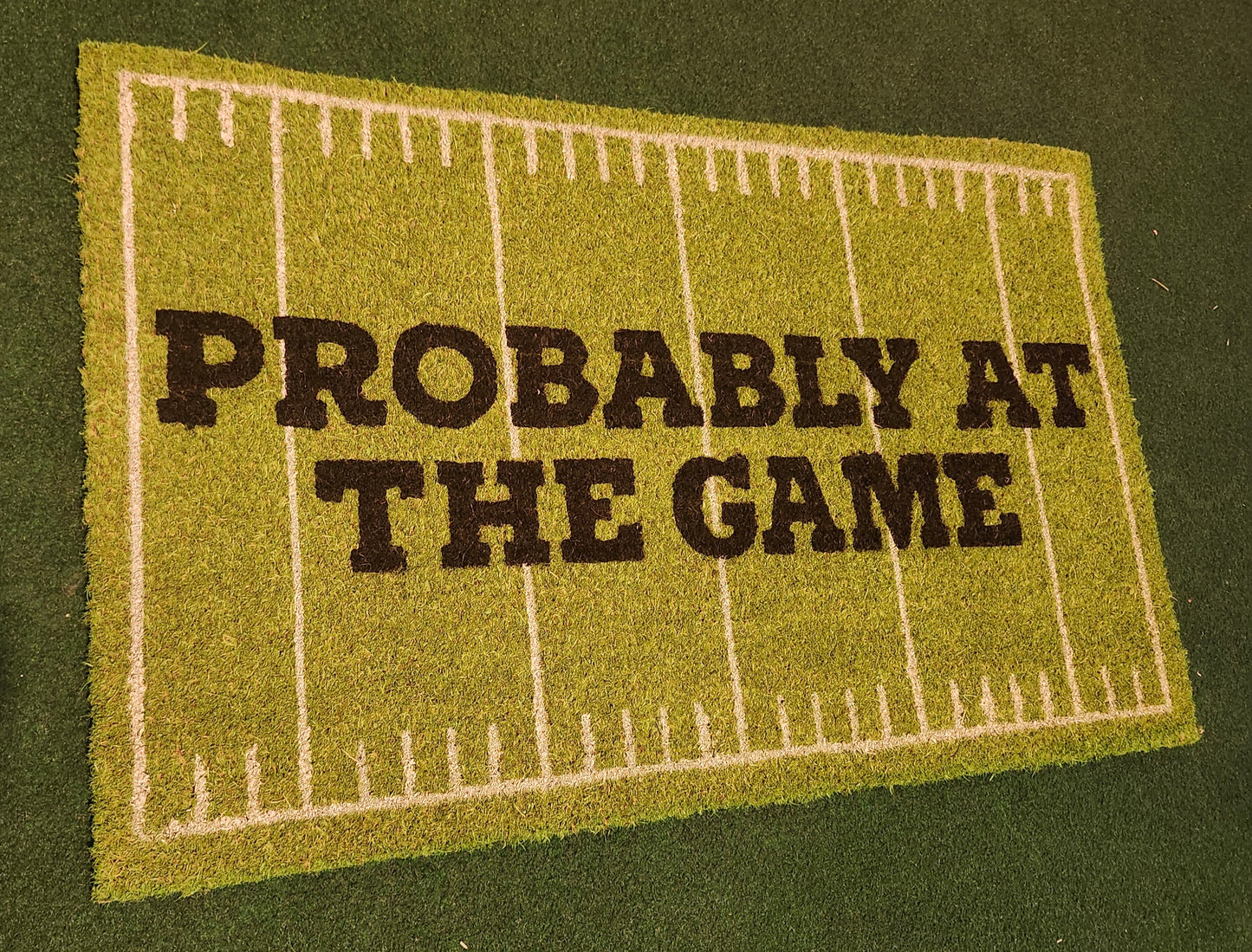 Probably at the game! Door mat.
